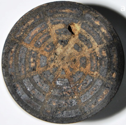 Inlet face of a dolomite core plug after laboratory acidizing, with a visible opening in the rock surface.